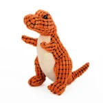 Doudou dinosaure orange joyeux, doux et câlin, parfait pour enfants et collectionneurs.