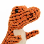 Jouet en peluche dinosaure T-rex orange, doux et amusant pour les enfants.