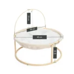 Berceau circulaire en bois, design doux et fonctionnel pour le confort des bébés.