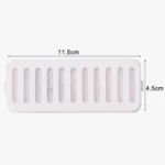 Rack de séchage blanc en silicone pour cuisine et salle de bain, compact et fonctionnel.