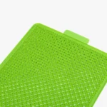 Tapis de silicone vert perforé, résistant à la chaleur, idéal pour la cuisine et la pâtisserie.