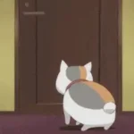 Une gif animée de chat cartoon ouvrant une porte.